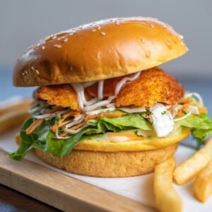Mouth-watering chicken burger with fries, perfect for lunch in Sydney, Australia.